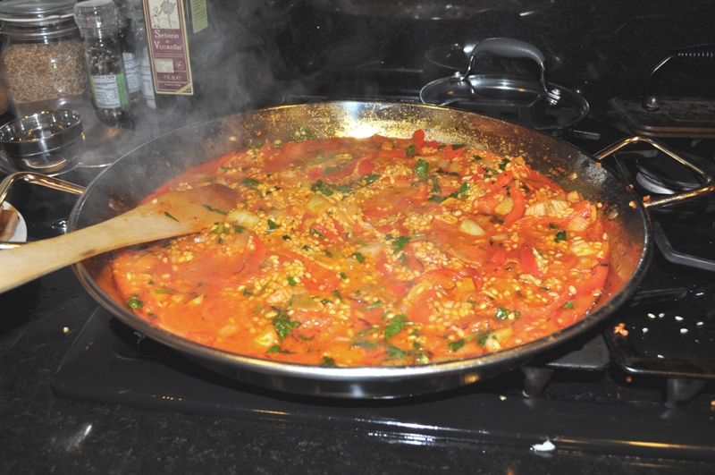 Paella cooking on the stove - first step